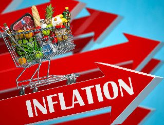 Shopping cart filled with groceries on a red arrow labeled Inflation, symbolizing rising prices against a blue background.