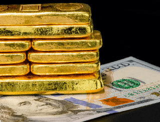 Stack of gold bars resting on top of scattered US dollar bills, signaling wealth or investment assets.