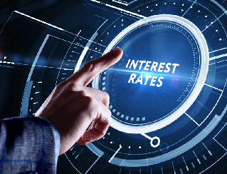 Hand tapping a holographic display reading 'Interest Rates' to symbolize focus on rate changes.