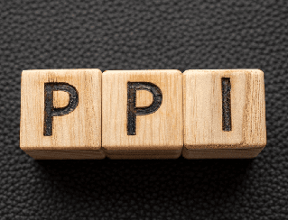 Three wooden letter cubes spelling 'PPI' on a dark textured background.