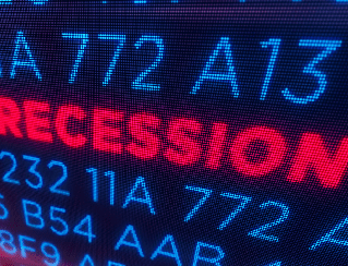Blue stock ticker numbers on a screen with a bold red word 'RECESSION' across it, signaling economic downturn.