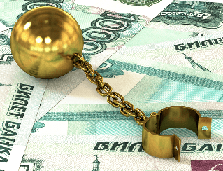 Gold ball and chain resting on Russian ruble banknotes, symbolizing financial burden or debt over money