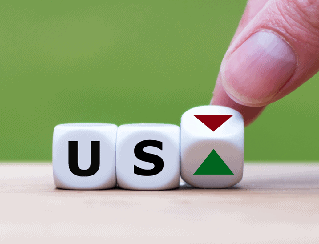 Close-up of blocks spelling 'US' being adjusted by a finger, with red down and green up arrows on the third block.
