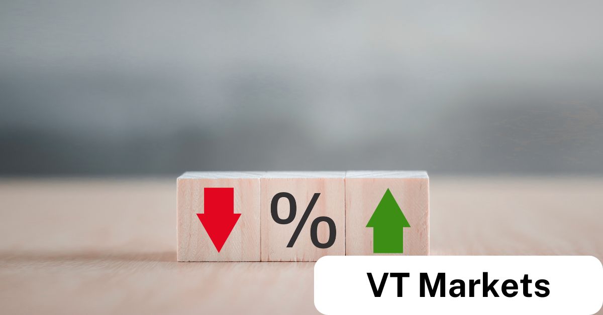 Wooden blocks showing a red down arrow, percentage sign, and green up arrow—representing the impact of overnight interest rates on trading positions with VT Markets.