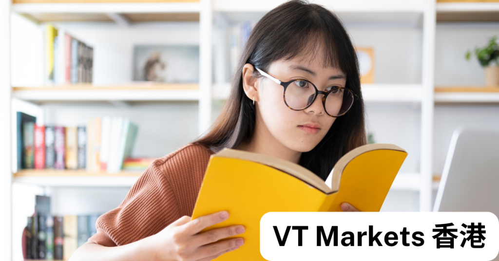 一位年輕女性正在閱讀外匯交易書籍，專注學習交易術語，象徵VT Markets 香港幫助新手掌握外匯知識。